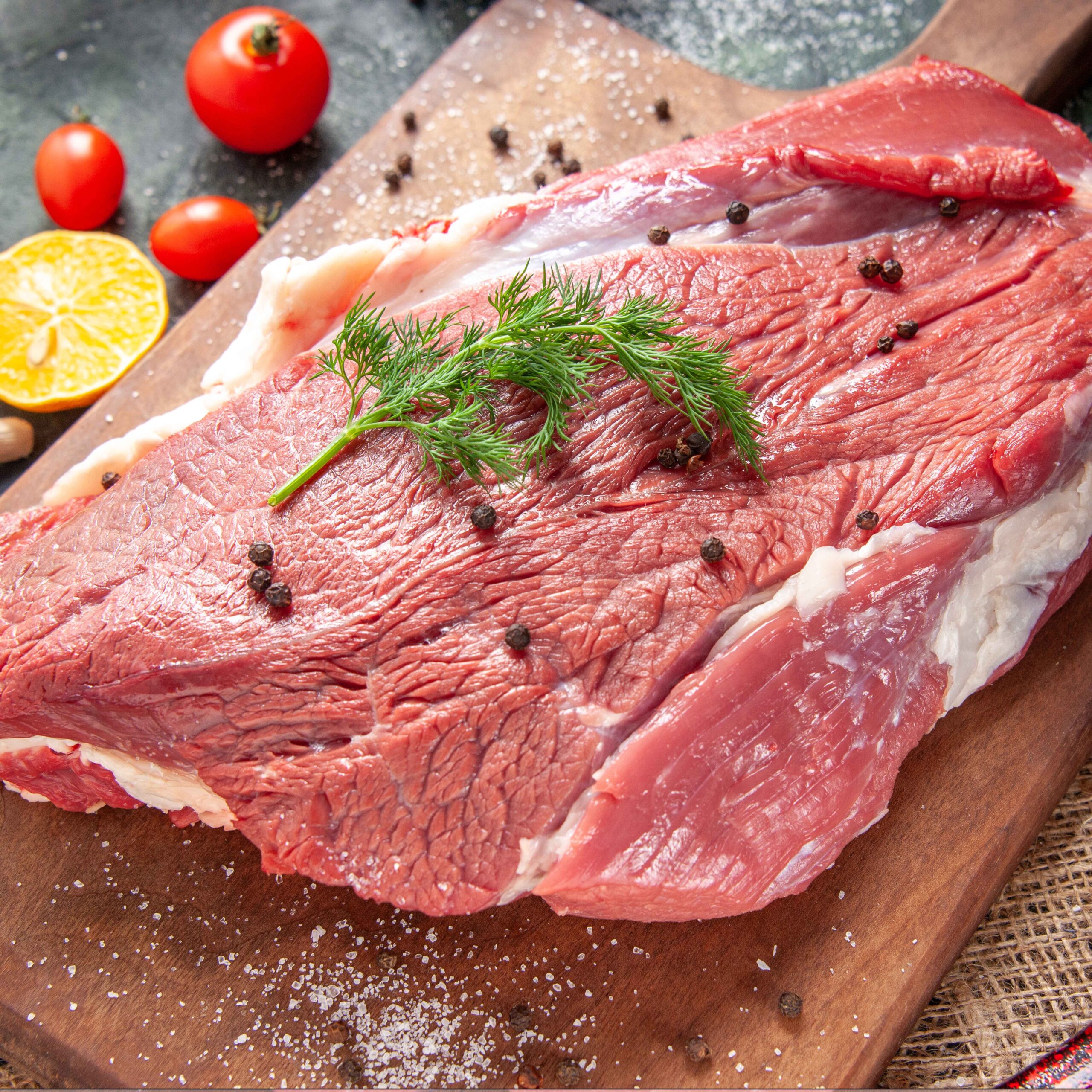 Front view of fresh raw red meat on wooden cutting board on nude Friboi Beef Brisket (7.5 to 8 Kg) - Image 1