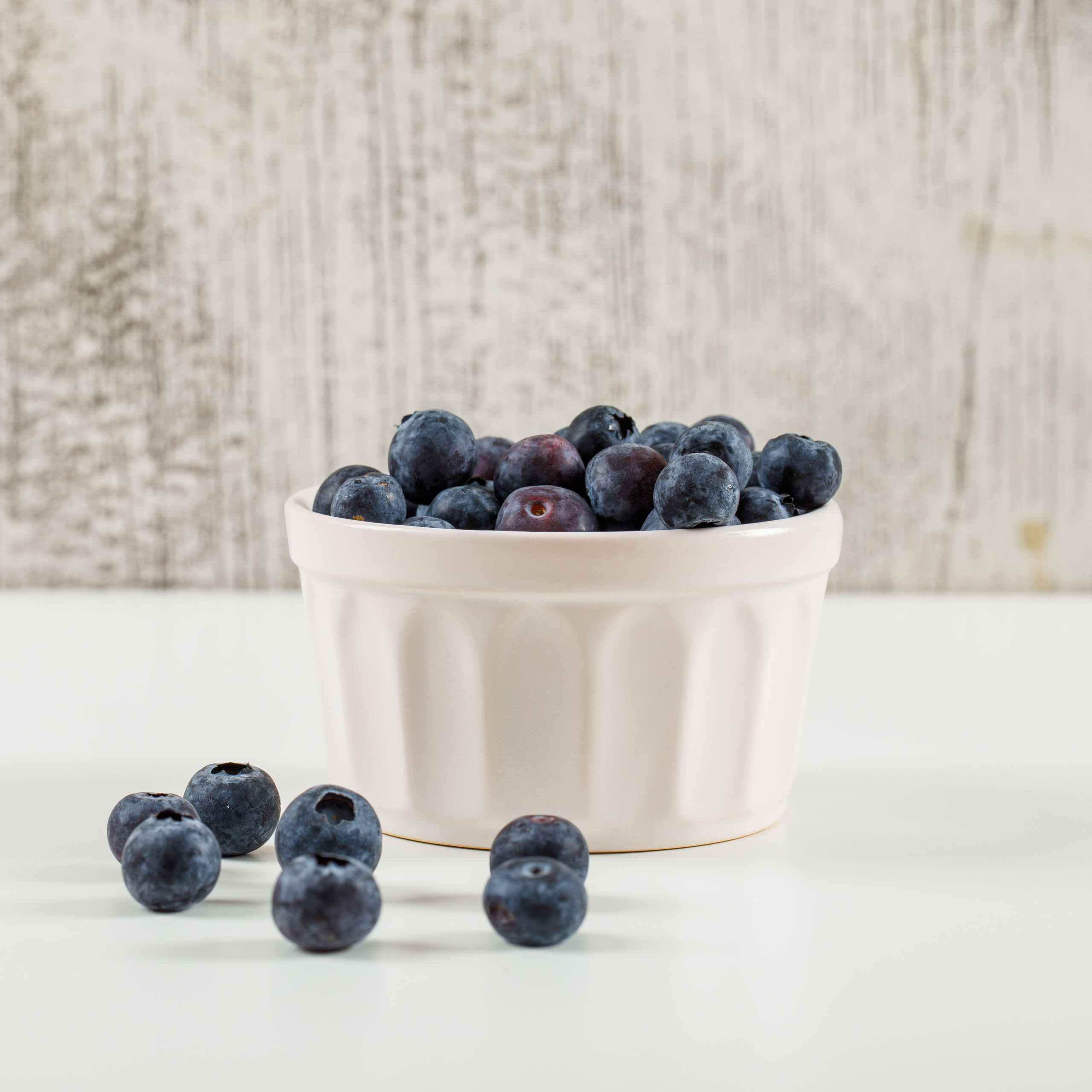 Sweet blueberries in a white bowl side view on a grunge and whit Blueberry Fruit (10 kg) - Image 1